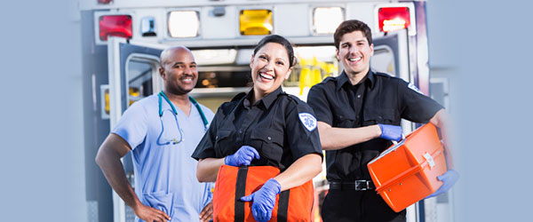 paramedics standing in front of an ambulance